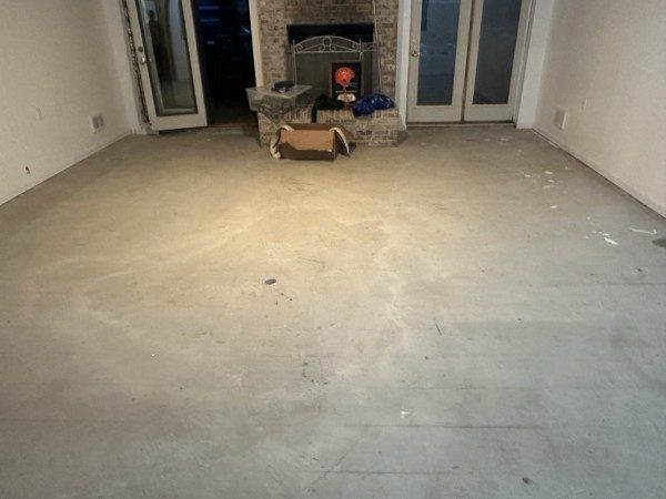 Basement before epoxy coating — bare concrete
